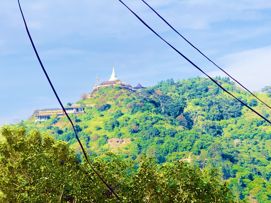 Expansive viewpoint over green valleys and mountain ridges in Sri Lanka
