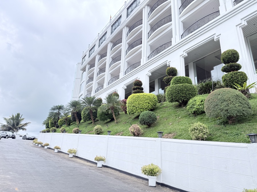 Sweeping panoramic viewpoint over mist-covered hills and tropical valleys