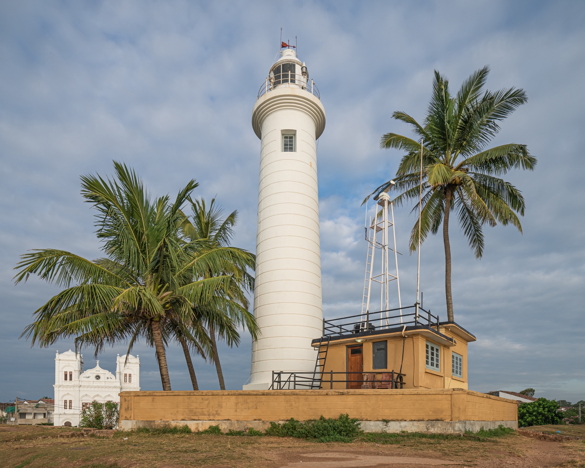 Historic Galle Fort lighthouse and ocean ramparts at sunset, Sri Lanka