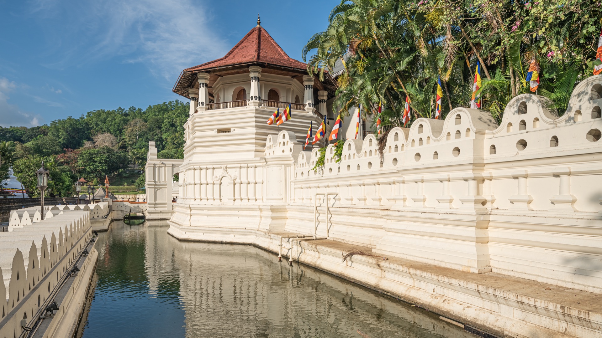 Historic Kandy Lake and sacred hills at twilight